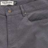 Close-up of Tom Beckbe Reid Straight Leg Cotton Chino Pant in gray with button, front pocket, and logo waistband label.