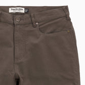 Close-up of Tom Beckbe Reid Straight Leg Cotton Chino Pant with front pockets, belt loops, and brand label.
