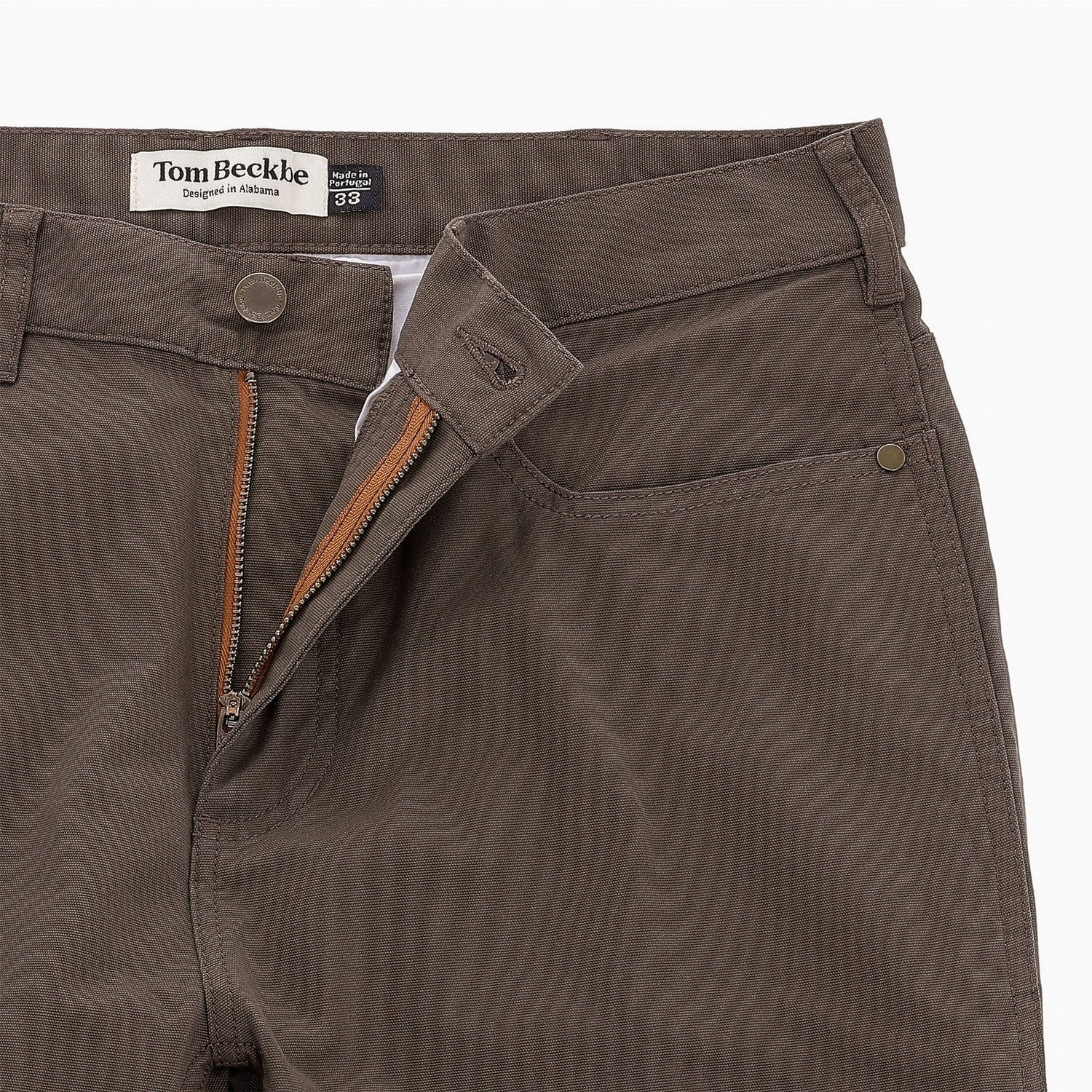 Men’s Reid Straight Leg Cotton Chino Pant by Tom Beckbe in brown with open zipper, button closure, and logo waistband.