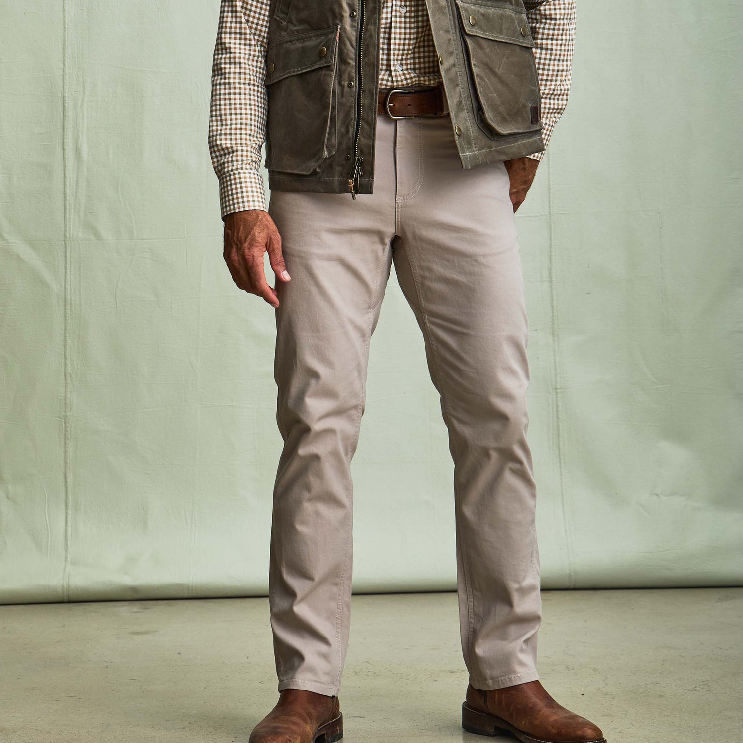A person in Tom Beckbe Reid Straight Leg Cotton Chino Pants stands against a plain background.