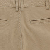 Reid Short by Tom Beckbe: beige, mid-rise with belt loops, rear pockets, center stitching, and texture.