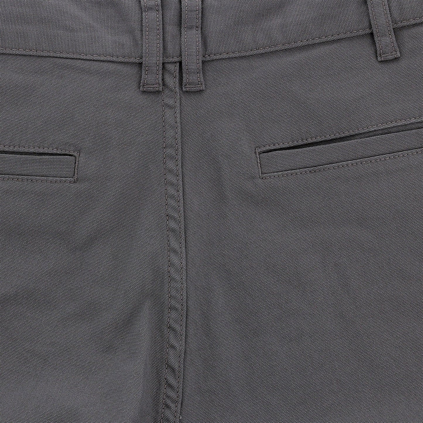 Close-up of mid-rise Tom Beckbe Reid Shorts with belt loops, welt pockets, and antique brass zip fly.