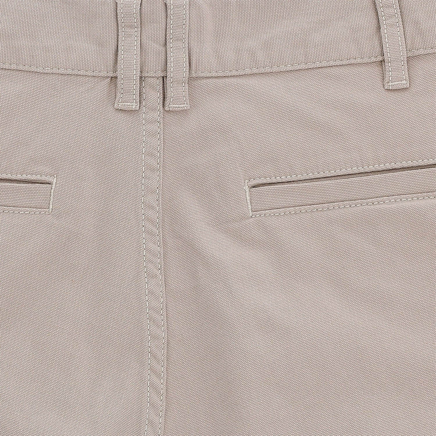Close-up of Tom Beckbes Reid Short in beige, featuring mid-rise, double belt loops, horizontal pockets, detailed stitching.