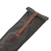 Tom Beckbe Canvas Roll Top Gun Sleeve in dark gray waxed cotton with a brown adjustable strap, shown on white.