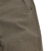 Close-up of Tom Beckbe's Stafford Double Front Pant highlighting a front pocket and detailed stitching.