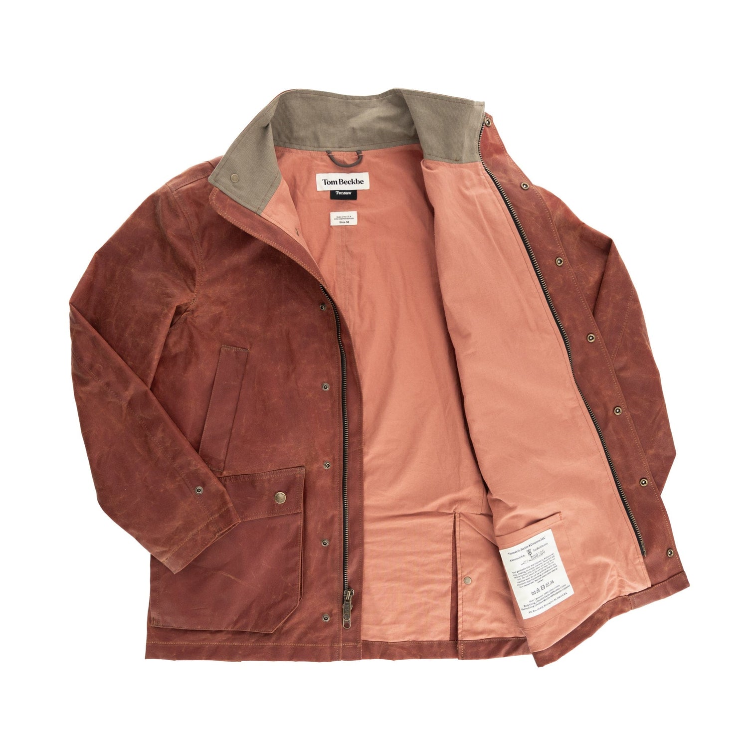 Tom Beckbes Fox Red Tensaw Jacket: brown waxed cotton, light pink lining, metal buttons; on white background.