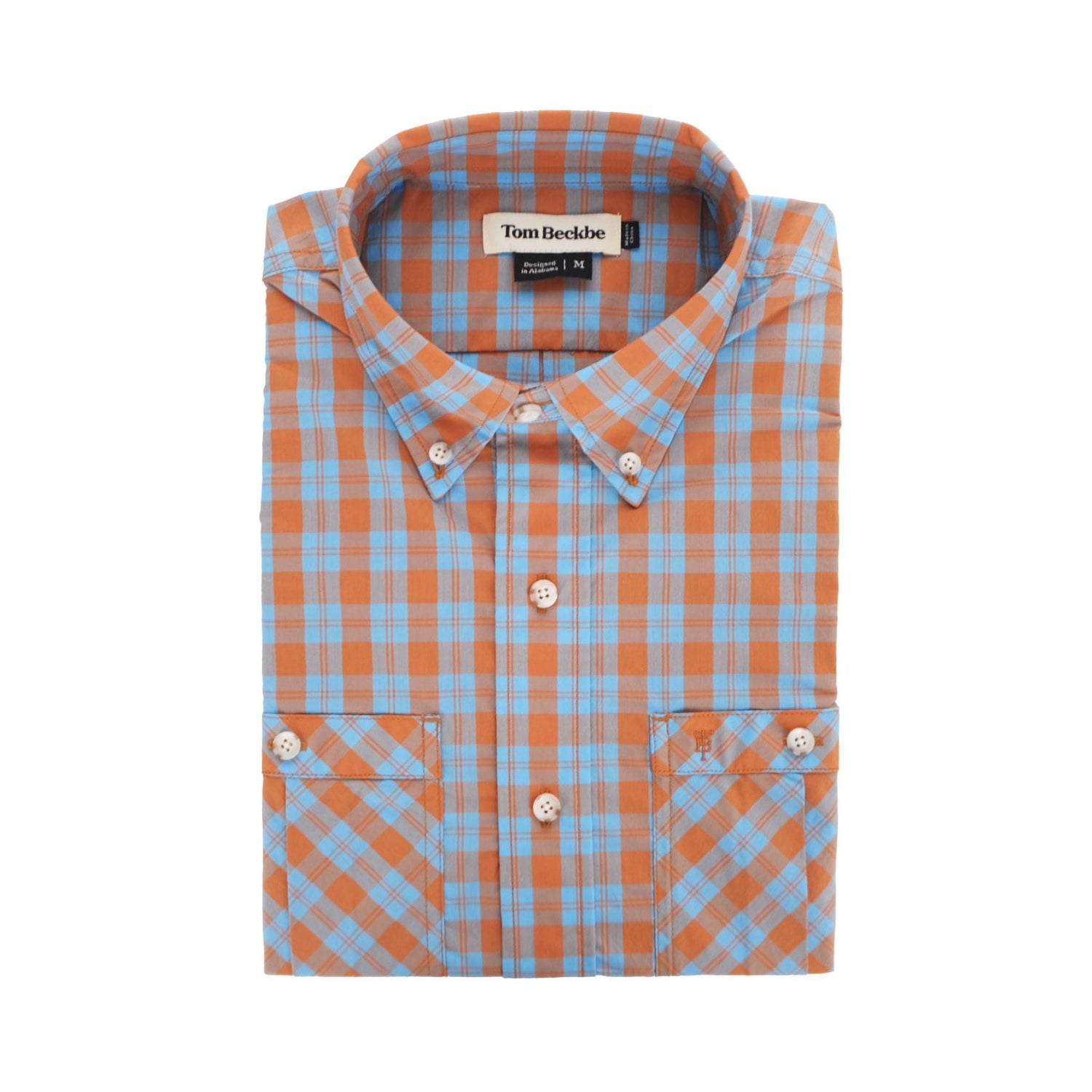 The Tom Beckbe Tidewater Shirt in orange and blue plaid offers UPF 30+ and features a neatly folded collar and pockets.