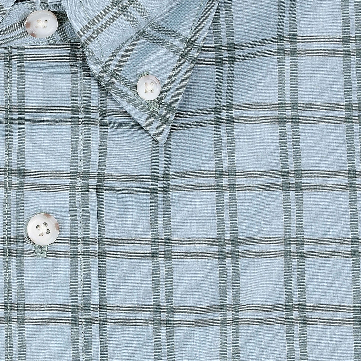 Close-up of the Tom Beckbe Tidewater Shirt, a light blue plaid outdoor shirt with white buttons and pointed collar.