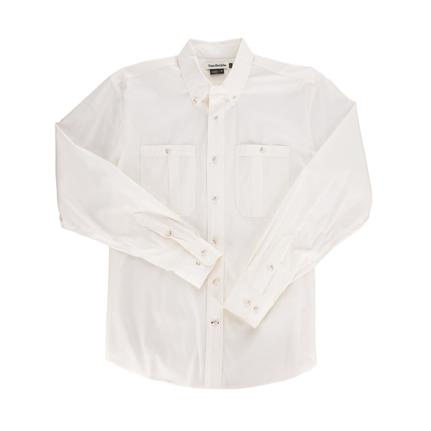White Tom Beckbe Tidewater long-sleeve shirt with chest pockets and buttoned cuffs, laid flat against a plain background.