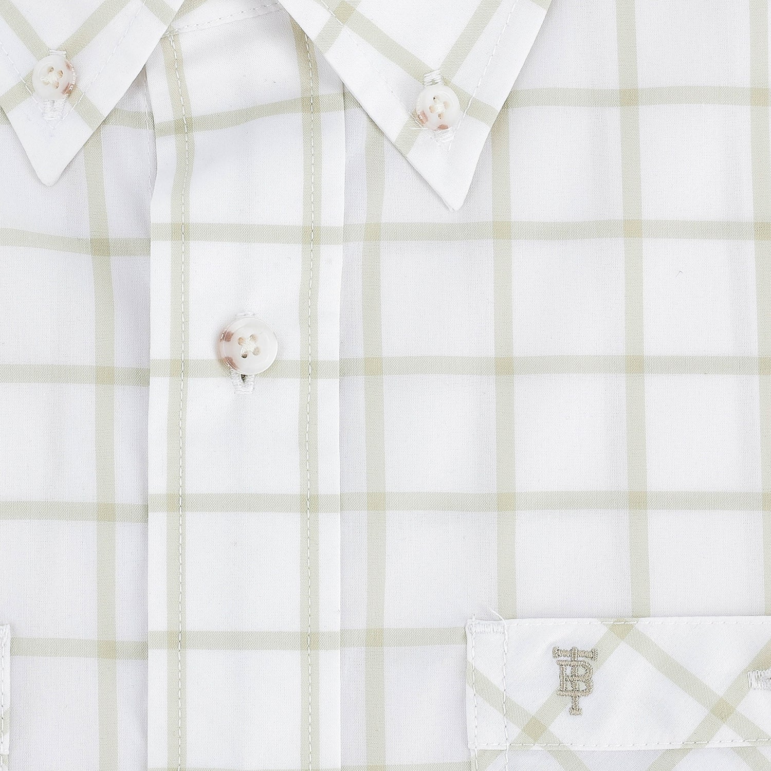 Close-up of the Tom Beckbe Tidewater Shirt: lightweight beige plaid, white buttons, and monogrammed pocket.
