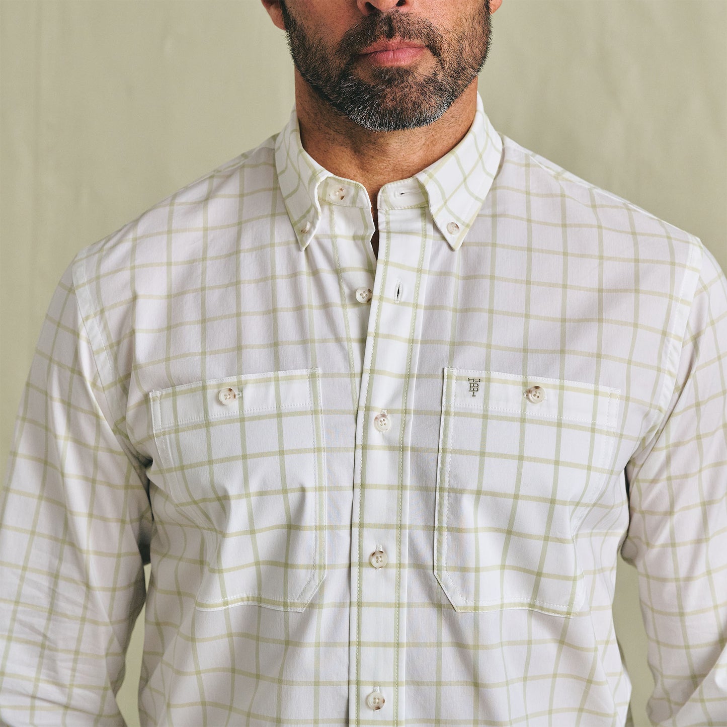 Man wearing the Tom Beckbe Tidewater Shirt with two chest pockets, standing against a plain background.