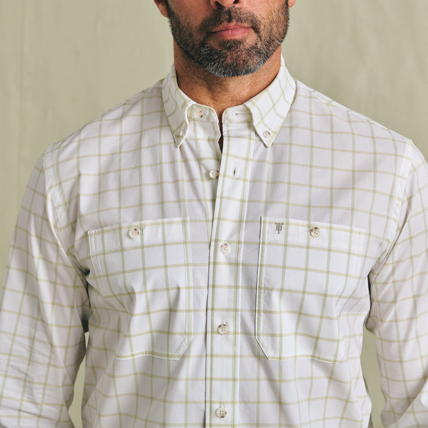 Man wearing the Tom Beckbe Tidewater Shirt with two chest pockets, standing against a plain background.