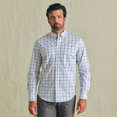 Man wearing the Tom Beckbe Tidewater Shirt, a UPF 30+ lightweight blue grid outdoor shirt, on a light background.