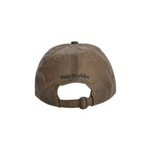 Tom Beckbe Waxed Cotton 6-Panel Hat - Cattle Brand, shown from back with leather strap and embroidery above opening.