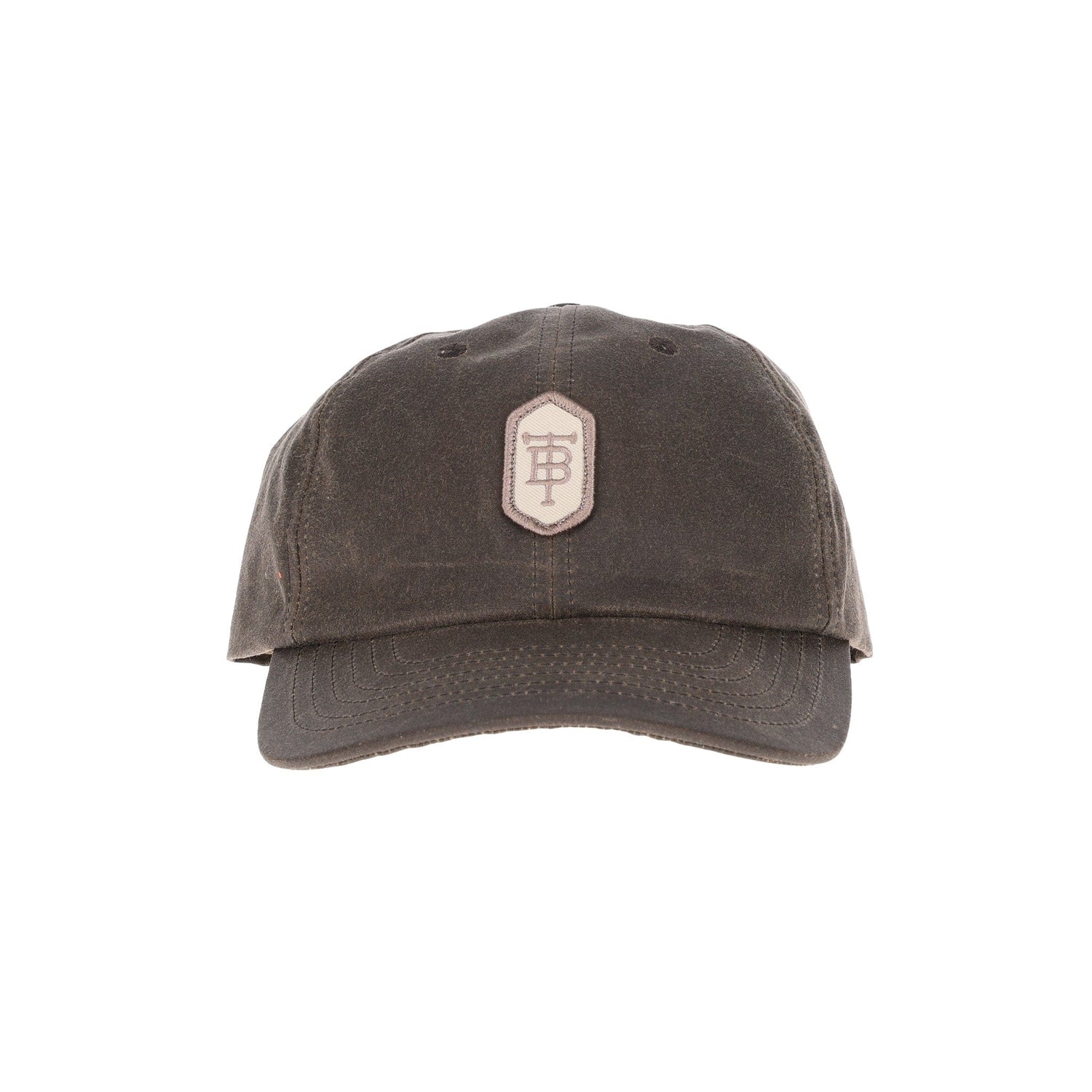 Tom Beckbes Waxed Cotton 6-Panel Baseball Hat features a dark brown design, embroidered patch, and premium leather strap.