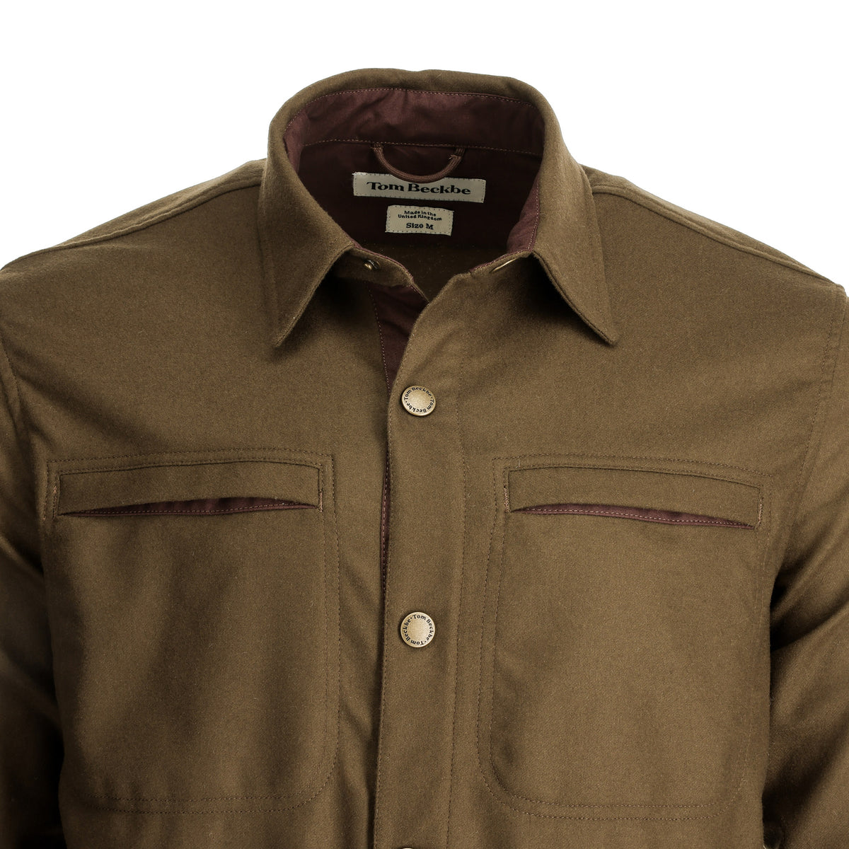 Tom Beckbe’s Westport Wool Overshirt features chest pockets, silver buttons, and contrast trim for a luxe finish.