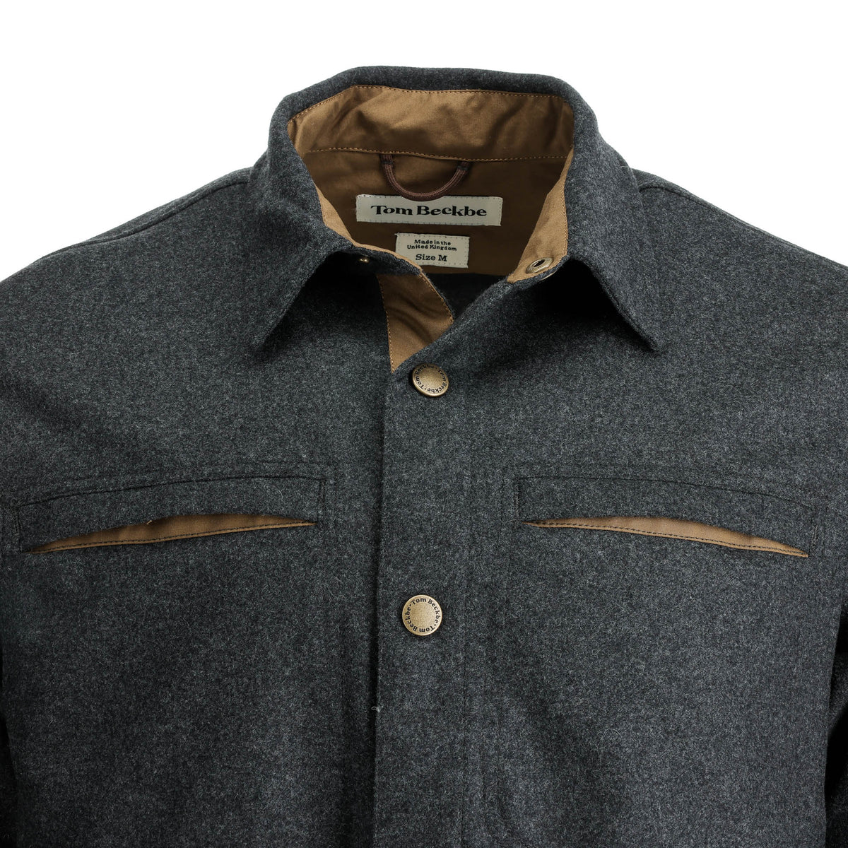 Close-up of Tom Beckbe’s Westport Wool Overshirt with brown accents, two chest pockets, and label on the collar.