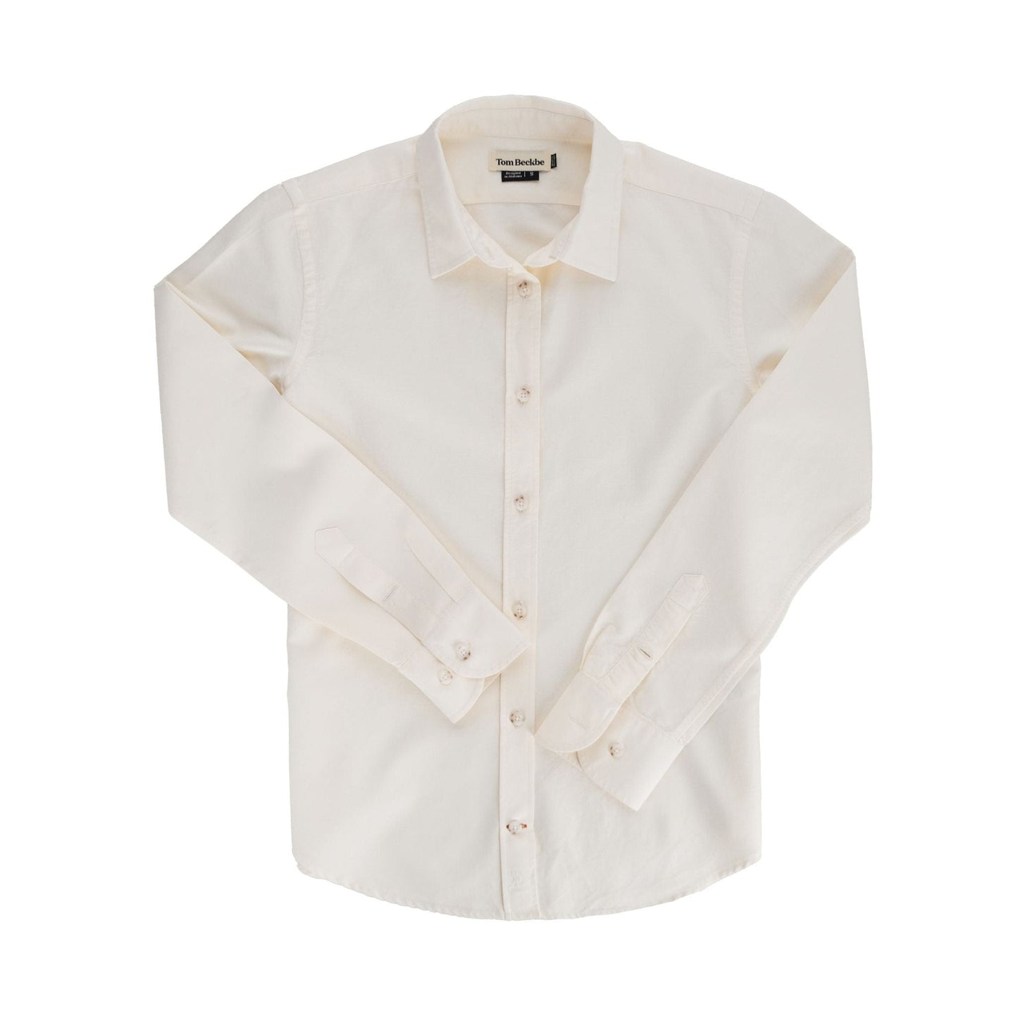Tom Beckbe Womens Oxford Shirt on white cotton with cuffs folded, spread collar, and visible buttons laid flat.