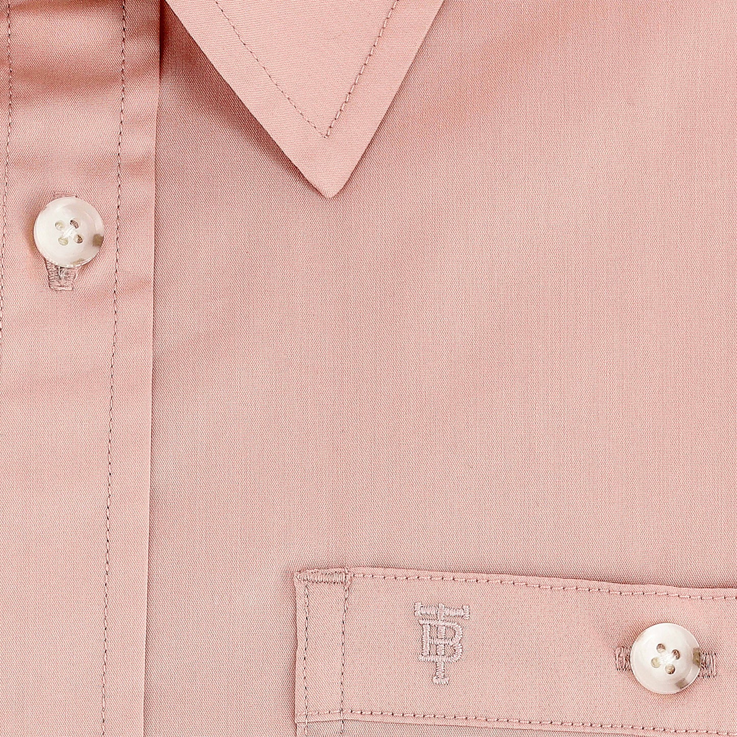 Close-up of Tom Beckbe Women's Tidewater Shirt with white buttons and subtle embroidered monogram near the pocket.