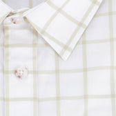 Close-up of the Tom Beckbe Women's Tidewater Shirt in white with a light beige plaid pattern and white buttons.
