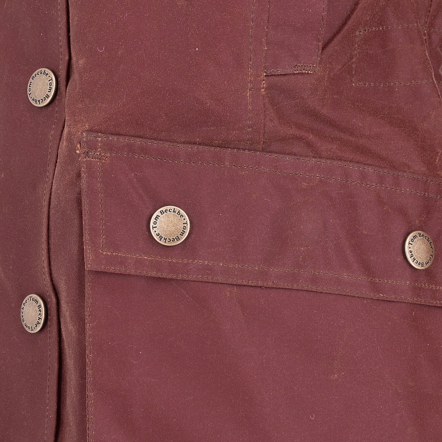 Close-up of the Tom Beckbe Women's Fox Red Blakeley Jacket, featuring metallic buttons and a front pocket.