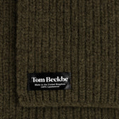 Close-up of a Tom Beckbe Wool Scarf, ribbed dark green, 100% lambswool, made in the UK.