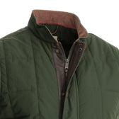Close-up of the Tom Beckbe Burgess Quilted Vest featuring a raised collar, zipper, and snap button closure.
