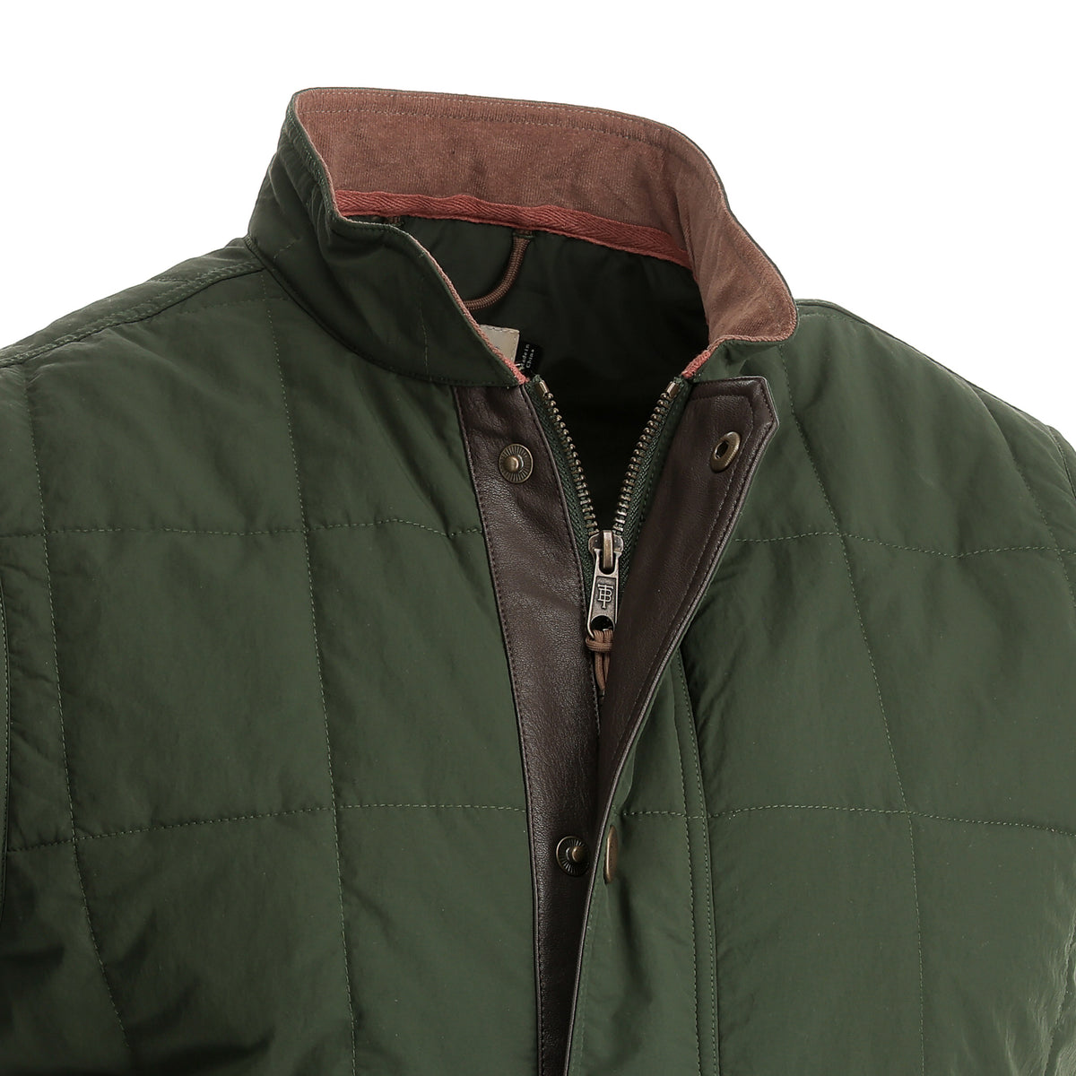 Close-up of the Tom Beckbe Burgess Quilted Vest featuring a raised collar, zipper, and snap button closure.