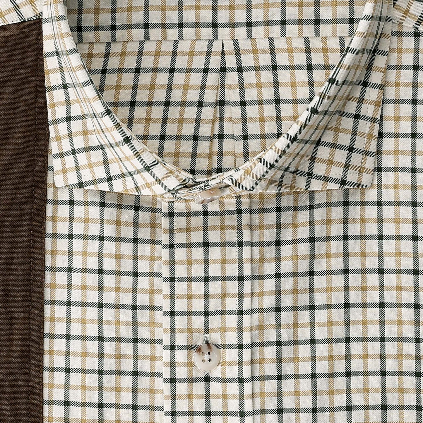 Close-up of the Carrington Shooting Shirt collar by Tom Beckbe in green/tan checks with brown fabric on the left side.