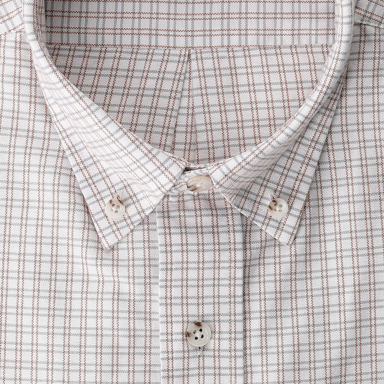 Tom Beckbe Culver Oxford Shirt: breathable fabric, brown/gray grid, button-down collar, white buttons, close up.