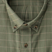 Close-up of a green plaid button-down shirt with light-colored grid lines and brown buttons.