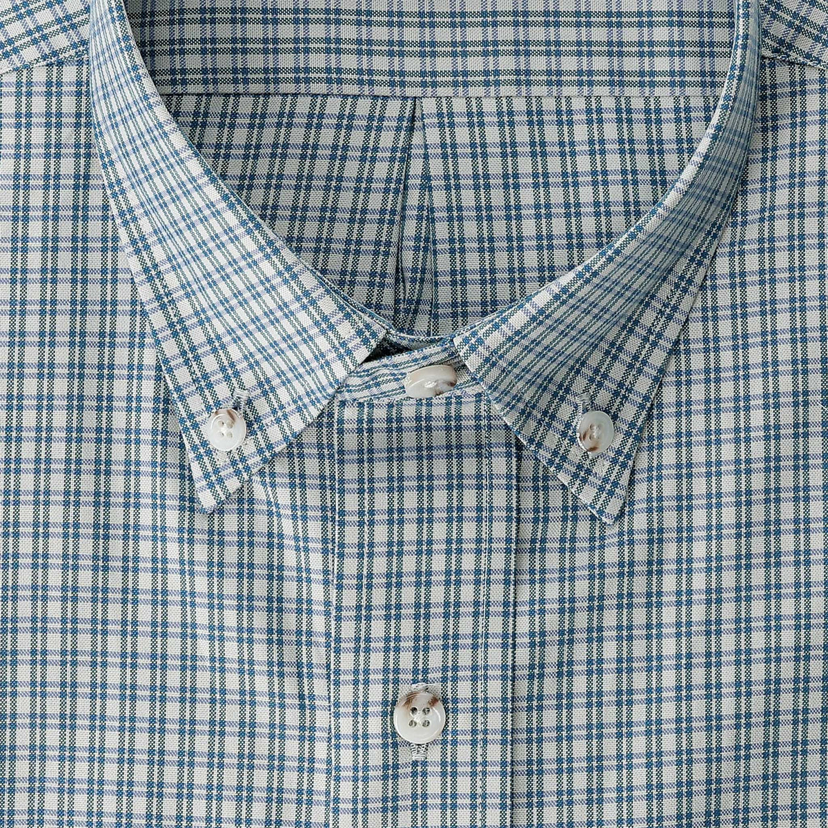 Close-up of Tom Beckbe’s Ensley Pinpoint Oxford Shirt collar, showing blue and white plaid and buttons.