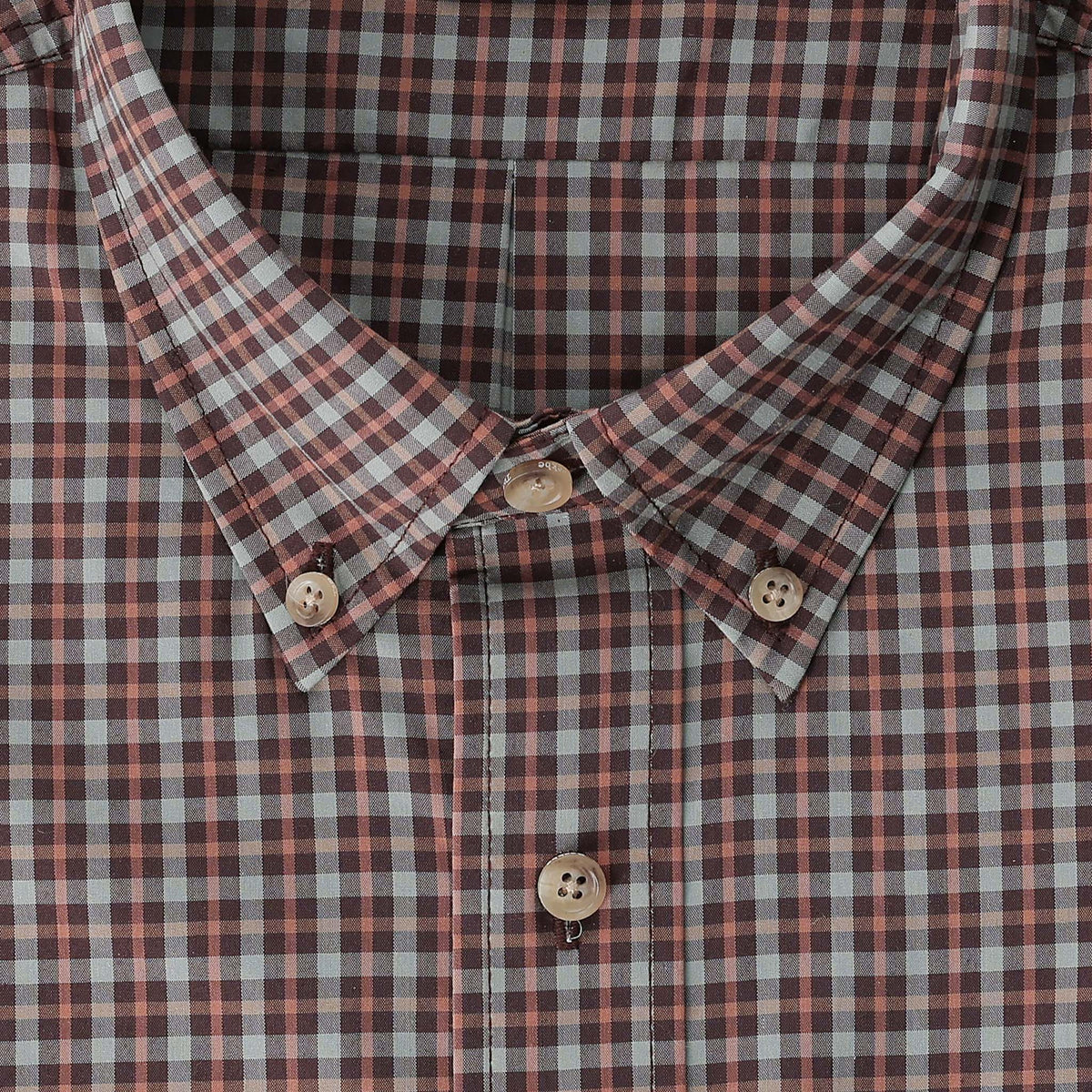 Close-up of Tom Beckbe’s Powell Performance Shirt in red, white & blue plaid with beige buttons and UPF 30+ protection.