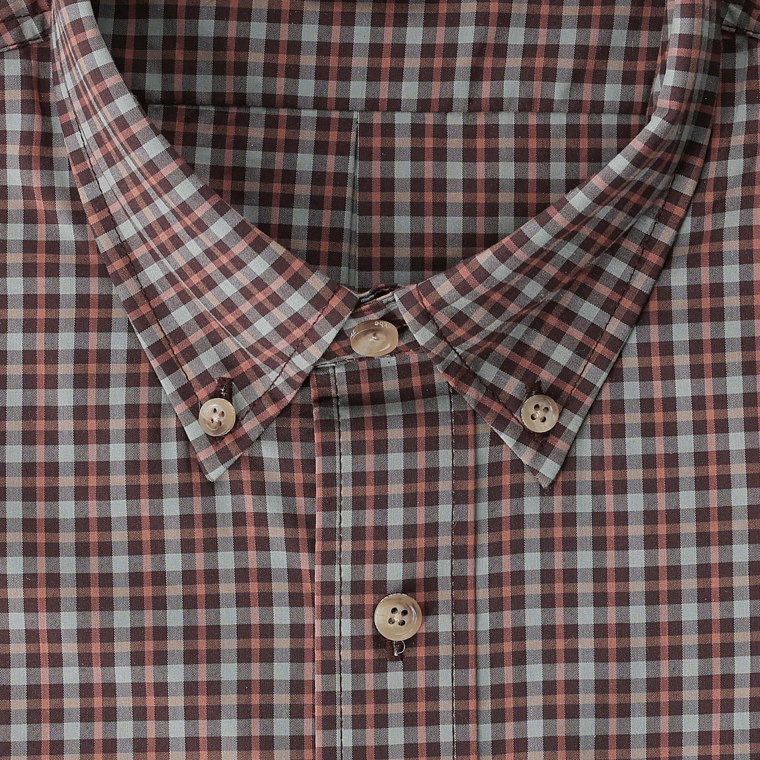 Close-up of Tom Beckbe’s Powell Performance Shirt in red, white & blue plaid with beige buttons and UPF 30+ protection.