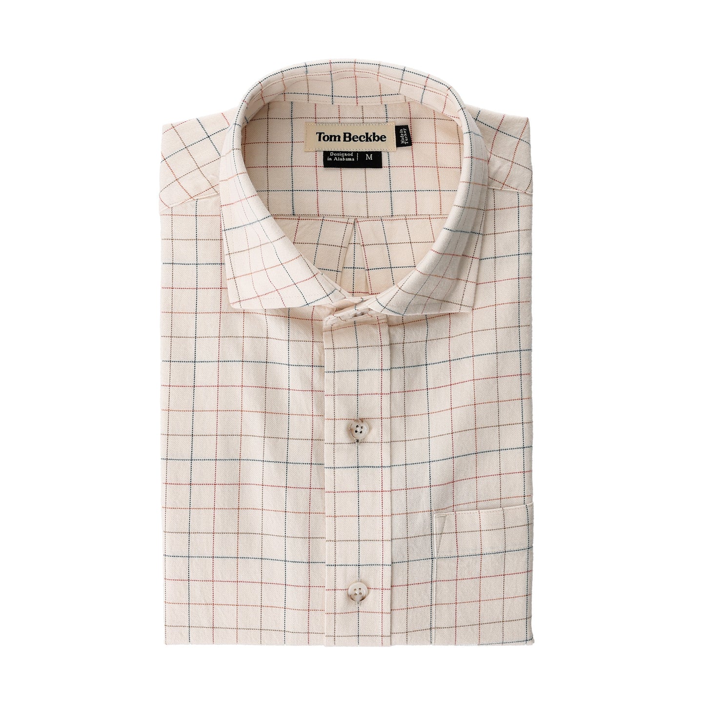 Folded Prescott Estate Twill Shirt in beige cotton with red-blue grid and Tom Beckbe label inside collar.