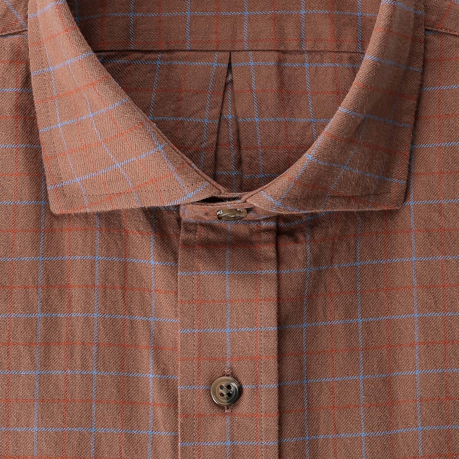 Close-up of the Tom Beckbe Prescott Estate Twill Shirt in brown plaid with blue lines and top buttonhole loop detail.