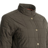 Close-up of Tom Beckbe’s Women’s Tyler Quilted Jacket with snap buttons, stand collar, and Repreve insulation on a mannequin.