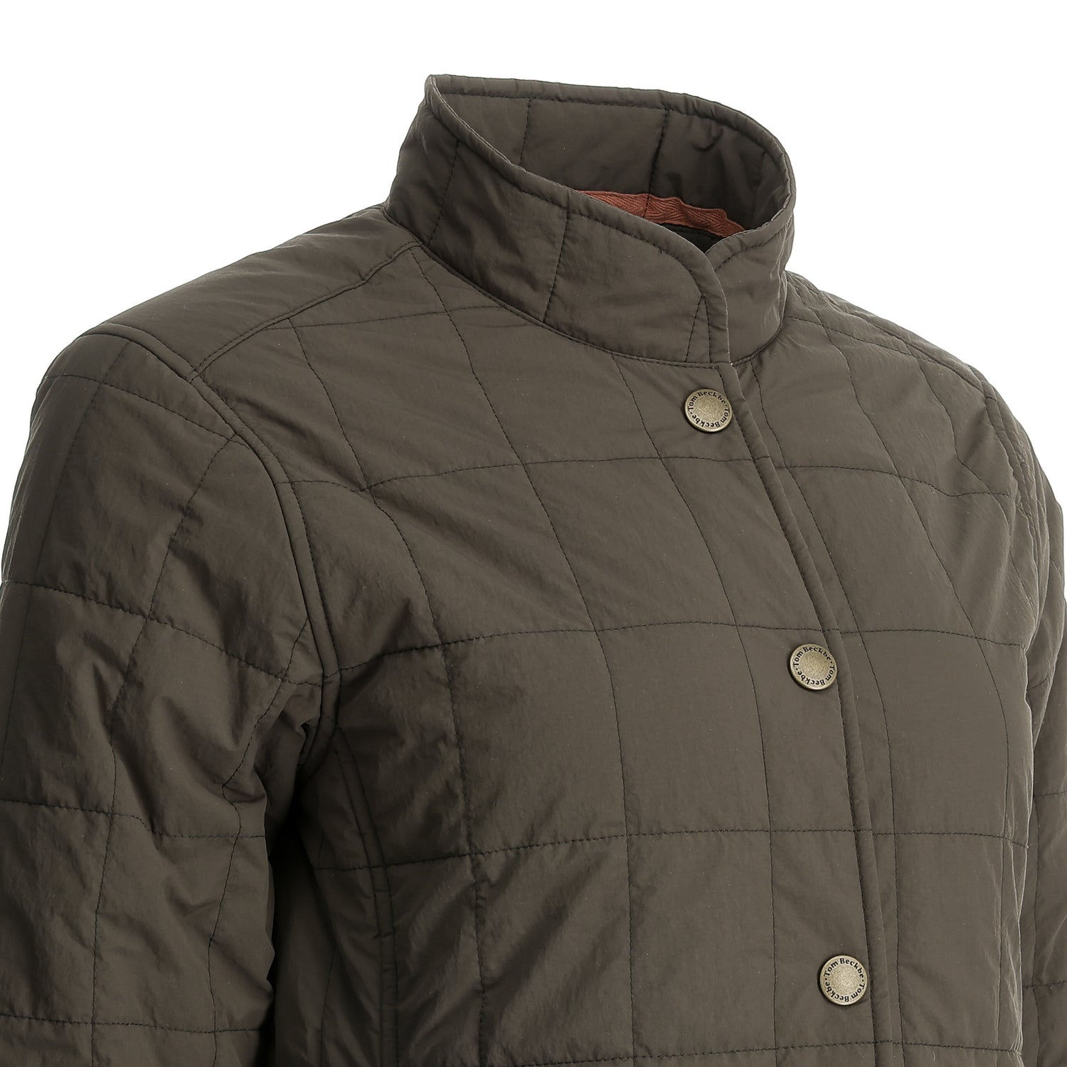 Close-up of Tom Beckbe’s Women’s Tyler Quilted Jacket with snap buttons, stand collar, and Repreve insulation on a mannequin.