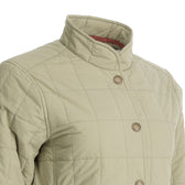 Close-up of Tom Beckbe Women’s Tyler Quilted Jacket with stand collar and button closures, shown on a mannequin.