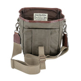 Open khaki DU Timber Bag with brown leather trim by Tom Beckbe; label reads DUCKS UNLIMITED inside.