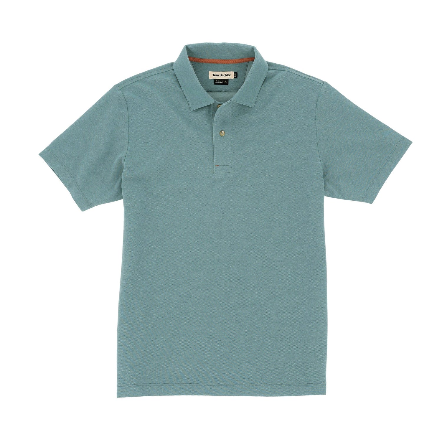 Tom Beckbes Coastal Polo Shirt, light blue, moisture-wicking, with collar and short sleeves, laid flat on a white background.