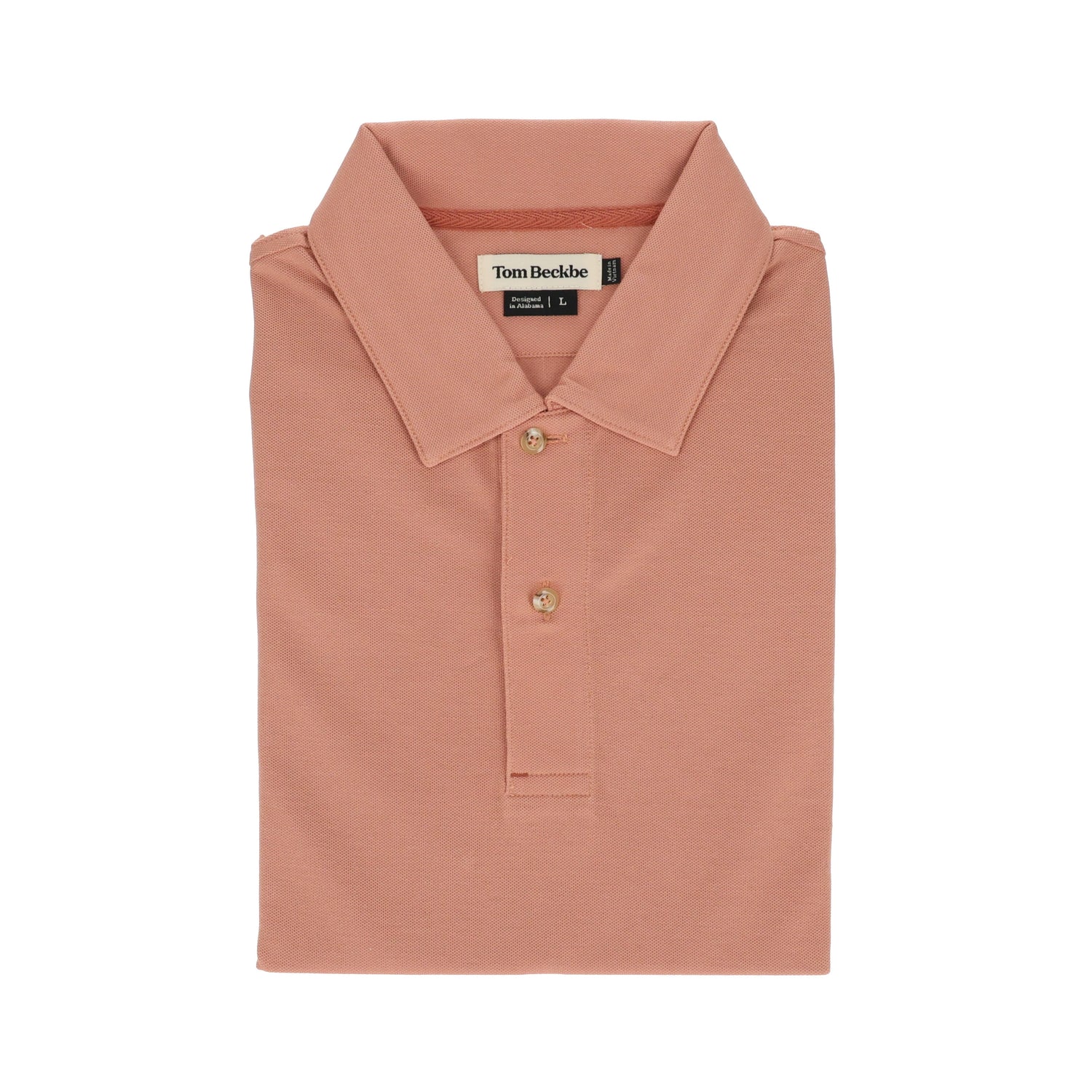 A folded Tom Beckbe Coastal Polo Shirt in peach, featuring a collar, three buttons, and moisture-wicking fabric.