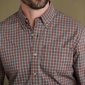 Man in Tom Beckbe Powell Performance Shirt, brown/white/blue plaid, shown shoulders to mid-chest.