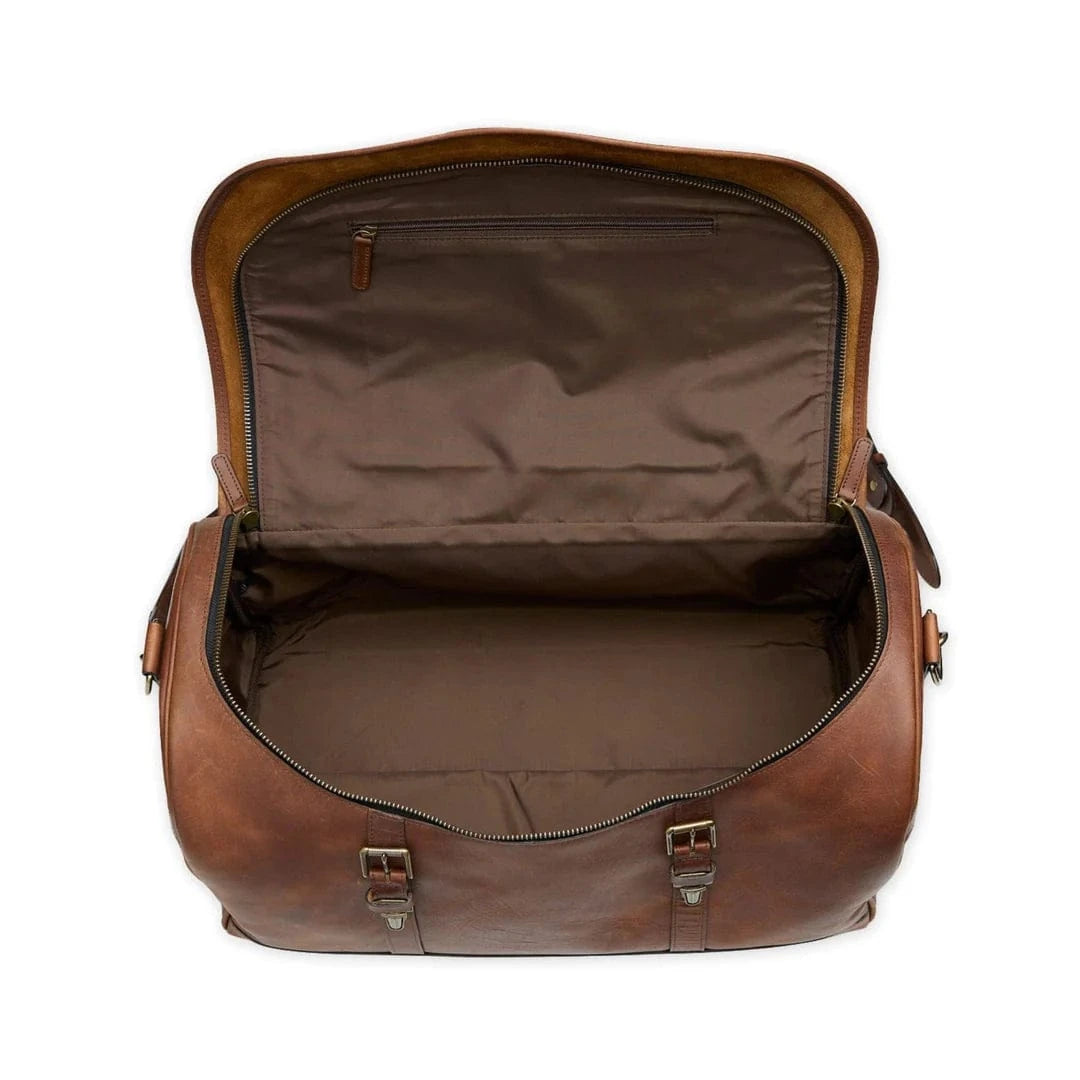 Tom Beckbe Leather Weekender Duffel Bag in brown full-grain leather, shown open and empty on a white background.