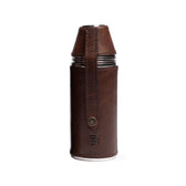 Tom Beckbe Bottle Flask (8oz) is wrapped in full-grain leather and a snap lid secures four cups.