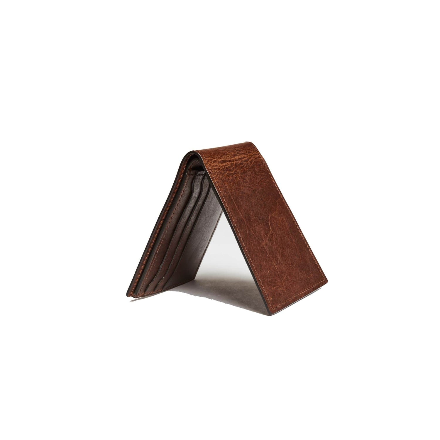 The leather bifold wallet is durable and features a slim silhouette that accommodates all essentials